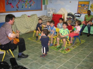 Music teacher singing with children